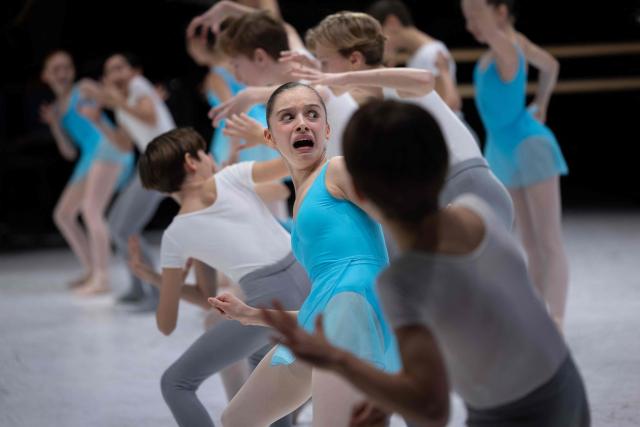 Students of the 5th division of the Paris Opera Ballet School perform on the stage of the Opera Garnier on December 15, 2024. It is a tradition passed down orally, from one generation of young dancers to the next: at the Paris Opera Ballet School, students are taught the art of French classical ballet, a three-century-old artistic heritage that is attracting more and more foreign dancers. (Photo by JOEL SAGET / AFP)