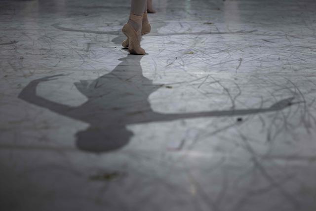 A student of the Paris Opera Ballet School performs on the stage of the Opera Garnier on December 15, 2024. It is a tradition passed down orally, from one generation of young dancers to the next: at the Paris Opera Ballet School, students are taught the art of French classical ballet, a three-century-old artistic heritage that is attracting more and more foreign dancers. (Photo by JOEL SAGET / AFP)