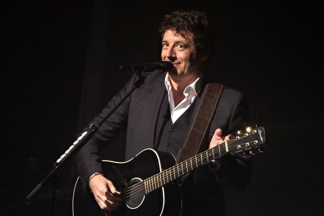 (FILES) French singer Patrick Bruel performs during a show in tribute to late French singer Barbara at the Theatre Mogador in Paris on March 28, 2016. French singer Patrick Bruel, accused of rape and sexual assault by several women, is set to appear before three investigating judges prior to possibly being placed under formal investigation, the Nanterre public prosecutor’s office has announced on the morning of June 10, 2026, adding that it has requested that he be placed in provisional custody. (Photo by MIGUEL MEDINA / AFP)