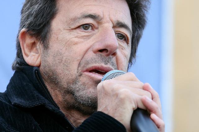 (FILES) French singer and actor Patrick Bruel speaks during a rally organised by the CRIF in support of Israeli hostages and in the memory of the victims of the October 7, 2023, in front of the Trocadero in Paris, on October 17, 2025. French singer Patrick Bruel, accused of rape and sexual assault by several women, is set to appear before three investigating judges prior to possibly being placed under formal investigation, the Nanterre public prosecutors office has announced on the morning of June 10, 2026, adding that it has requested that he be placed in provisional custody. (Photo by Alain JOCARD / AFP)