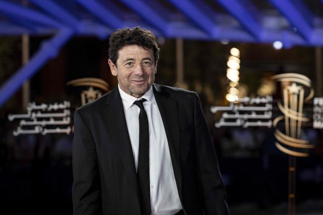 (FILES) French singer and actor Patrick Bruel poses on the red carpet upon her arrival for the opening ceremony of the 19th Marrakech International Film Festival in Marrakech on November 11, 2022. French singer Patrick Bruel, accused of rape and sexual assault by several women, is set to appear before three investigating judges prior to possibly being placed under formal investigation, the Nanterre public prosecutors office has announced on the morning of June 10, 2026, adding that it has requested that he be placed in provisional custody. (Photo by FADEL SENNA / AFP)