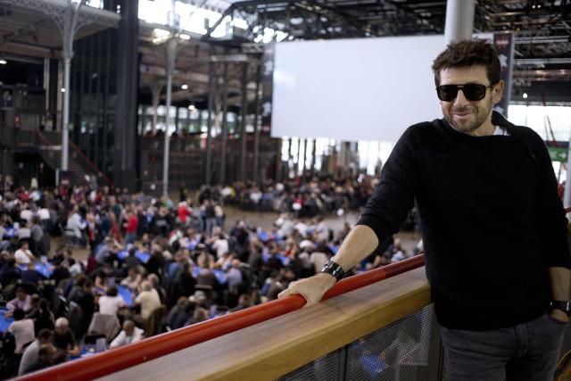 (FILES) French singer and poker player Patrick Bruel poses on October 25, 2014 during the launch of the Winamax poker tour in Paris. French singer Patrick Bruel, accused of rape and sexual assault by several women, is set to appear before three investigating judges prior to possibly being placed under formal investigation, the Nanterre public prosecutor’s office has announced on the morning of June 10, 2026, adding that it has requested that he be placed in provisional custody. (Photo by Kenzo TRIBOUILLARD / AFP)