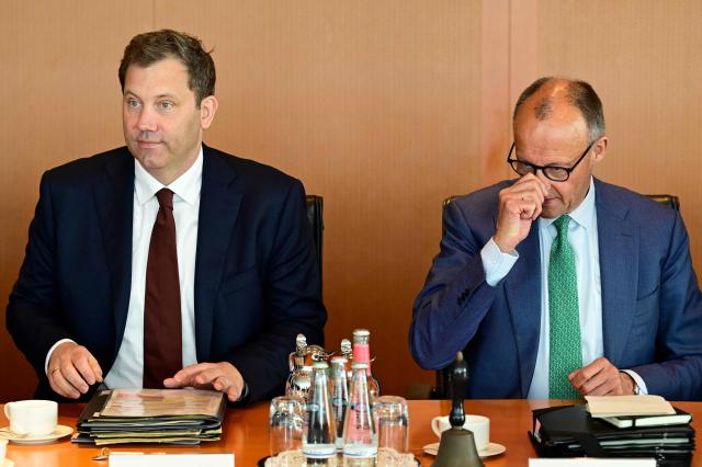 German Finance Minister and Vice Chancellor Lars Klingbeil and Germany's Chancellor Friedrich Merz take their seat prior to the weekly cabinet meeting at the Chancellery in Berlin on June 10, 2026. (Photo by John MACDOUGALL / AFP)