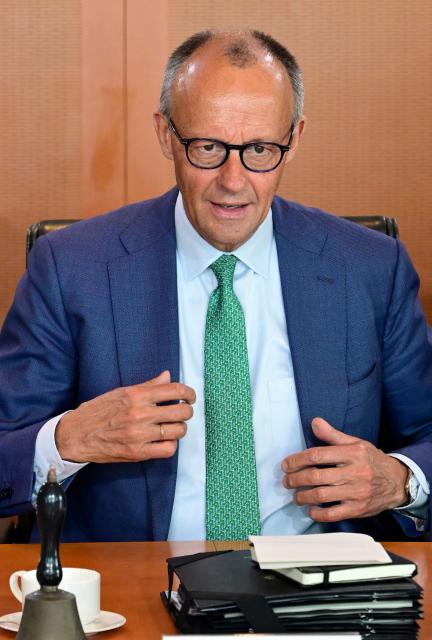 German Chancellor Friedrich Merz talks prior to the weekly cabinet meeting at the Chancellery in Berlin on June 10, 2026. (Photo by John MACDOUGALL / AFP)