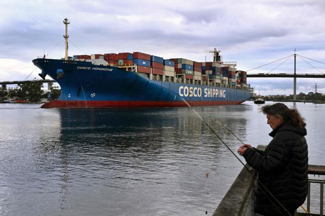 The 280-metre-long Cosco Hong Kong container ship enters the Port of Melbourne, Australia's largest container port, in Melbourne on June 10, 2026. (Photo by William WEST / AFP)