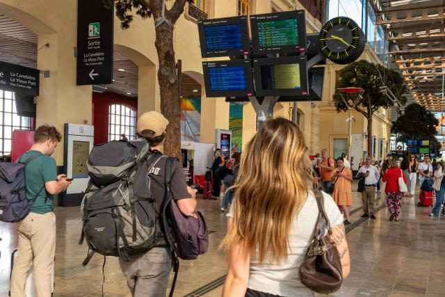 Commuters look at the screens indicating departure and arrival times as well as disruptions due to a SNCF national strike movement at the Saint-Charles train station in Marseille, southern France, on June 10, 2026. Some TGV high-speed trains are cancelled on June 10, morning, as well as regional and suburban trains, which are increasingly open to competition, as part of a 24-hour strike organized by SNCF unions. Traffic on June 10 morning is in line with forecasts, SNCF Voyageurs told AFP: regional traffic—the “everyday trains”—is “severely disrupted,” and on long-distance routes an average of one in three TGVs has been cancelled, along with one in two Intercitйs trains. (Photo by MIGUEL MEDINA / AFP)
