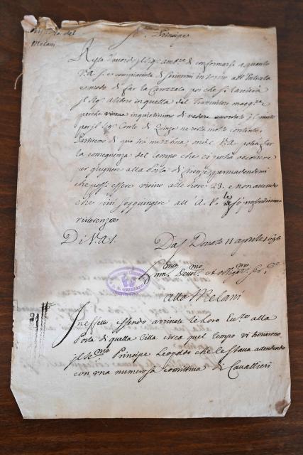 This photograph taken on June 5, 2026 shows a letter bearing the signature of Atto Melani during a press preview as part of the exhibition "Atto Melani (16261714). The Secret Voice of Power," at the Labronica Library of Villa Fabbricotti in Livorno on June 5, 2026. A celebrated singer in the courts of Tuscany, Venice, Rome, and France, a protégé of Cardinal Mazarin and close associate of the Sun King, Louis XIV of France, Atto Melani transformed his theatrical success into an extraordinary diplomatic career. Castrated as a child, he constantly struggled between public prestige and the human burden of his condition, yet he managed to become a political mediator, informer, and protagonist in the conclaves that marked the history of the papacy between 1667 and 1700. (Photo by Andreas SOLARO / AFP)