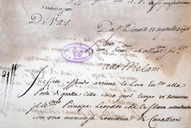 This photograph taken on June 5, 2026 shows a letter bearing the signature of Atto Melani during a press preview as part of the exhibition "Atto Melani (16261714). The Secret Voice of Power," at the Labronica Library of Villa Fabbricotti in Livorno on June 5, 2026. A celebrated singer in the courts of Tuscany, Venice, Rome, and France, a protégé of Cardinal Mazarin and close associate of the Sun King, Louis XIV of France, Atto Melani transformed his theatrical success into an extraordinary diplomatic career. Castrated as a child, he constantly struggled between public prestige and the human burden of his condition, yet he managed to become a political mediator, informer, and protagonist in the conclaves that marked the history of the papacy between 1667 and 1700. (Photo by Andreas SOLARO / AFP)