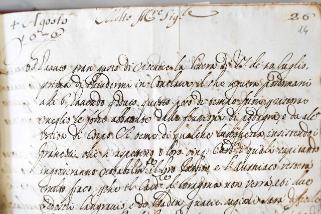 This photograph taken on June 5, 2026 shows a close view of a manuscript diplayed during a press preview as part of the exhibition "Atto Melani (16261714). The Secret Voice of Power," at the Labronica Library of Villa Fabbricotti in Livorno on June 5, 2026. A celebrated singer in the courts of Tuscany, Venice, Rome, and France, a protégé of Cardinal Mazarin and close associate of the Sun King, Louis XIV of France, Atto Melani transformed his theatrical success into an extraordinary diplomatic career. Castrated as a child, he constantly struggled between public prestige and the human burden of his condition, yet he managed to become a political mediator, informer, and protagonist in the conclaves that marked the history of the papacy between 1667 and 1700. (Photo by Andreas SOLARO / AFP)