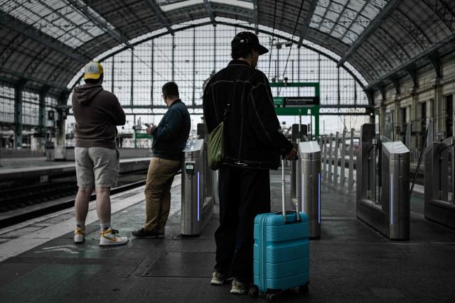 Travellers wait on a platform of the Saint-Jean railway station during a nationwide strike of French national railway company SNCF workers in Bordeaux, south-western France, on June 10, 2026. Some TGV high-speed trains are cancelled on June 10, morning, as well as regional and suburban trains, as part of a 24-hour strike organized by SNCF unions as the four representative rail unions — CGT-Cheminots, UNSA-Ferroviaire, SUD-Rail and CFDT-Cheminots — called a one-day walkout for their first joint national action since late 2024, to denounce internal restructuring and demand higher wages. (Photo by Philippe LOPEZ / AFP)