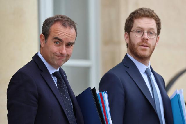 France's Prime Minister Sebastien Lecornu (L) and France’s junior Minister for Public Accounts David Amiel leave after the weekly cabinet meeting at the Elysee Palace in Paris on June 10, 2026. (Photo by Ludovic MARIN / AFP)
