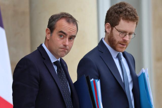 France's Prime Minister Sebastien Lecornu (L) and France’s junior Minister for Public Accounts David Amiel leave after the weekly cabinet meeting at the Elysee Palace in Paris on June 10, 2026. (Photo by Ludovic MARIN / AFP)