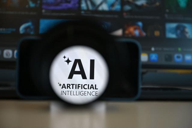 This photograph shows a logo of artificial intelligence displayed on a smartphone's screen, in Brussels on June 10, 2026. (Photo by Nicolas TUCAT / AFP)