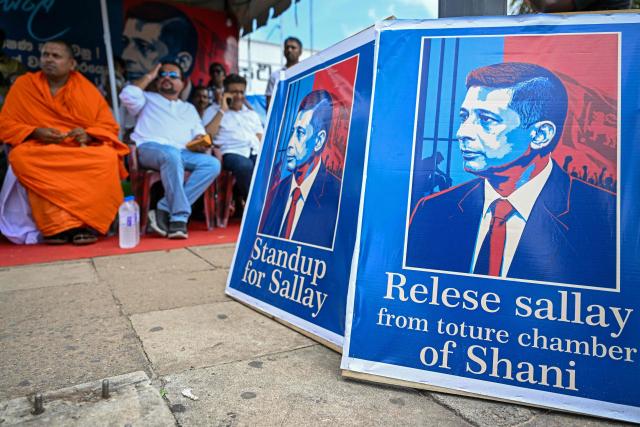 Sri Lanka's opposition activists demanding the release of detained former intelligence chief Suresh Sallay take part in a sit-in protest outside the railway station in Colombo on June 10, 2026. Sri Lanka's public security minister told parliament on June 10 the nation's ex-intelligence chief directed the 2019 Easter Sunday attack, in the first official statement linking him directly to the bombings that killed 279 people. (Photo by Ishara S. KODIKARA / AFP)