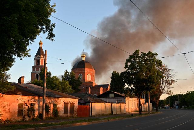 This photograph shows smoke rising above a church following an air attack in Kharkiv on June 10, 2026, amid the Russian invasion of Ukraine. (Photo by SERGEY BOBOK / AFP)