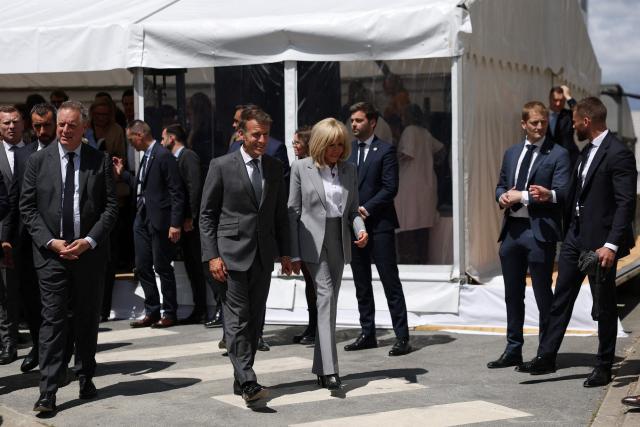 French President Emmanuel Macron (C-L) and his wife Brigitte Macron (C-R) arrive to attend the foundation stone laying ceremony for the Child Brain Institute (ICE - Institut Robert-Debre du Cerveau de l’Enfant) at the Robert-Debre Hospital in Paris on June 10, 2026. (Photo by Gonzalo Fuentes / POOL / AFP)