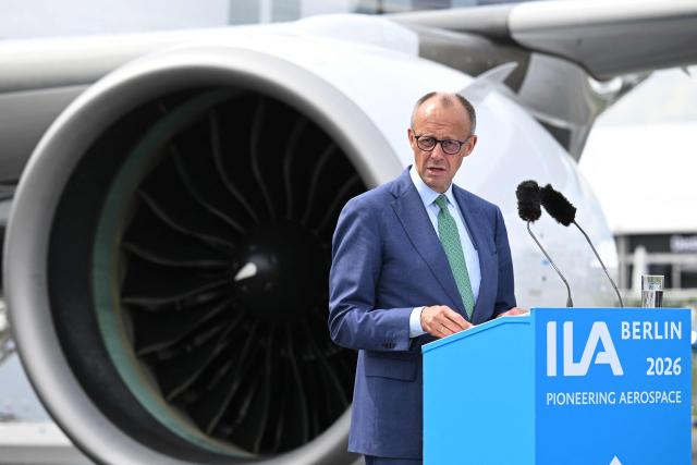German Chancellor Friedrich Merz delivers his speech during the opening ceremony of the International Aerospace Exhibition (ILA) in Schoenefeld, near Berlin on June 10, 2026. (Photo by RALF HIRSCHBERGER / AFP)
