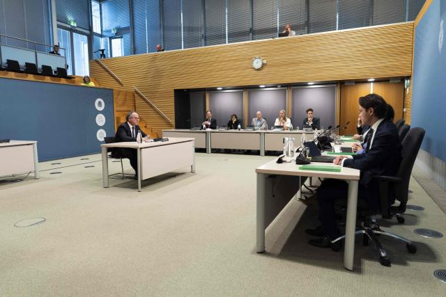 Former Dutch Minister of Social Affairs and Employment Wouter Koolmees (centre L) takes part in the public hearings of the parliamentary inquiry committee into the coronavirus policy in The Hague on June 10, 2026. (Photo by Jeroen Jumelet / ANP / AFP) / Netherlands OUT