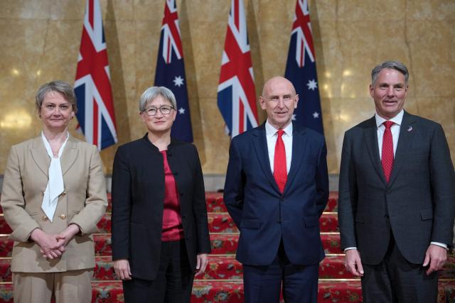 Britain's Foreign Secretary Yvette Cooper (L), Australia’s Minister for Foreign Affair Penny Wong (2L), Britain's Defence Secretary John Healey (2R) and Australia's Deputy Prime Minister and Minister for Defence Richard Marles, pose for a photo during the annual Australia-UK Ministerial Consultations (AUKMIN) meeting in London on June 10, 2026. (Photo by Kin Cheung / POOL / AFP)