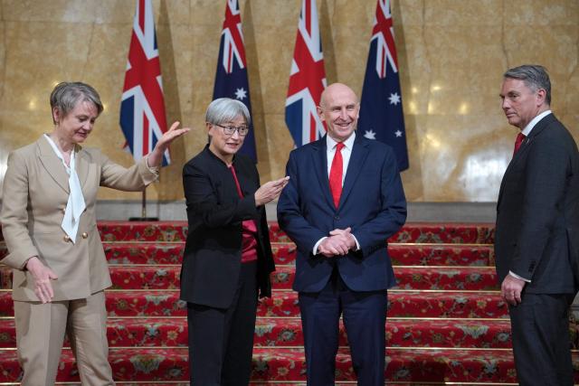 Britain's Foreign Secretary Yvette Cooper (L), Australia’s Minister for Foreign Affair Penny Wong (2L), Britain's Defence Secretary John Healey (2R) and Australia's Deputy Prime Minister and Minister for Defence Richard Marles, pose for a photo during the annual Australia-UK Ministerial Consultations (AUKMIN) meeting in London on June 10, 2026. (Photo by Kin Cheung / POOL / AFP)