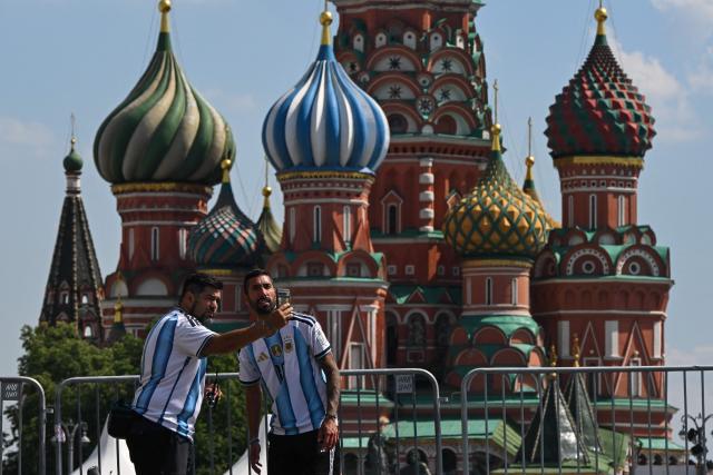 Tourists take a selfie picture with St Basil's Cathedral in the background during a hot day in central Moscow on June 10, 2026. (Photo by Igor IVANKO / AFP)