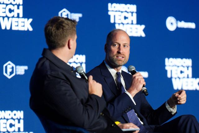 Britain's Prince William, Prince of Wales (R) speaks with English broadcaster Jake Humphrey (L) during a panel discussion at London Tech Week in London on June 10, 2026, to highlight the role of data and technology in preventing homelessness. (Photo by Aaron Chown / POOL / AFP)