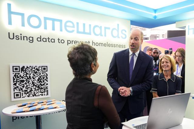 Britain's Prince William, Prince of Wales (C) visits the charity Homewards stand as he attends London Tech Week in London on June 10, 2026, to highlight the role of data and technology in preventing homelessness. (Photo by Aaron Chown / POOL / AFP)