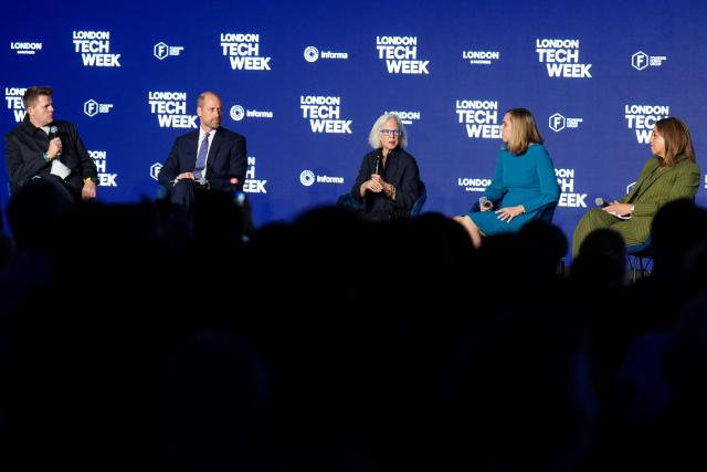 Britain's Prince William, Prince of Wales (2nd L) takes part in a panel discussion with host, English broadcaster Jake Humphrey (L), Linda Gibbs (C), Solange Chamberlain (2nd R) and Zahra Bahrololoumi (R) at London Tech Week in London on June 10, 2026, to highlight the role of data and technology in preventing homelessness. (Photo by Aaron Chown / POOL / AFP)