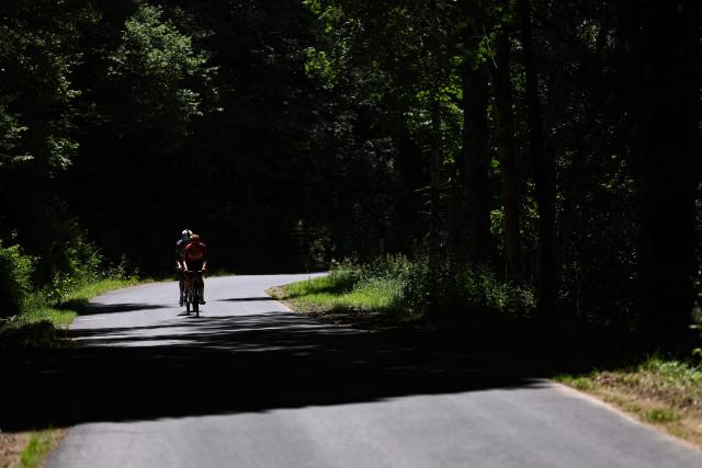 Lidl-Trek's US rider Quinn Simmons and Uno-X Mobility's Danish rider Andreas Kron cycle in a breakaway during the 4th stage of the Tour Auvergne-Rhone-Alpes cycling race (formerly known as the Criterium du Dauphine), 167,4km between Le Puy-en-Velay and Montrond-les-Bains, central France, on June 10, 2026. (Photo by Anne-Christine POUJOULAT / AFP)