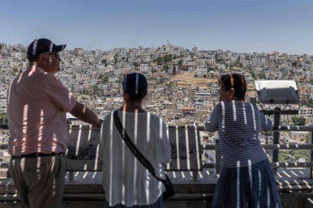 American tourists look on from a viewpoint in Hebron, in the Israeli occupied West Bank on June 10, 2026. Israel has occupied the West Bank since 1967, and violence has sharply escalated in the Palestinian territory since the Gaza war began in 2023. (Photo by ilia YEFIMOVICH / AFP)