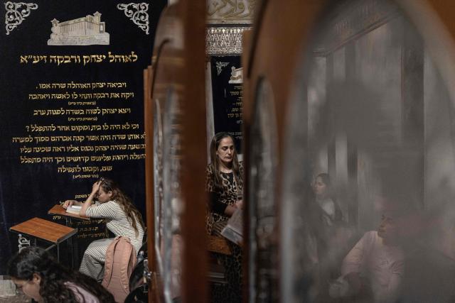 Women pray at The Cave of the Patriarchs (Me'arat HaMachpela) in Hebron, in the Israeli occupied West Bank on June 10, 2026. Israel has occupied the West Bank since 1967, and violence has sharply escalated in the Palestinian territory since the Gaza war began in 2023. (Photo by ilia YEFIMOVICH / AFP)