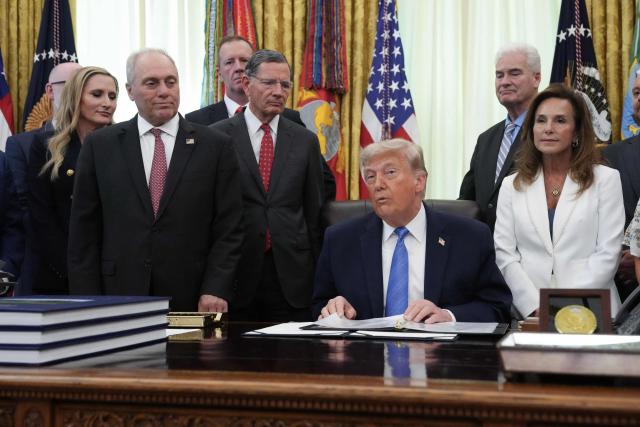 Republican members of Congress look on as US President Donald Trump speaks during a signing ceremony for the "Secure America Act" in the Oval Office of the White House in Washington, DC, on June 10, 2026. The bill provides around $38 billion for Immigration and Customs Enforcement (ICE), $26 billion for Border Patrol and another $5 billion for unforeseen costs, effectively ensuring a steady flow of money for Trump's deportation agenda through fiscal 2029. (Photo by Ken Cedeno / AFP)