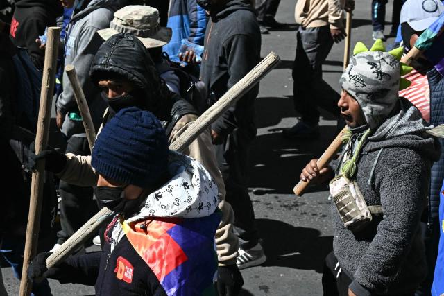 Demonstrators carrying wooden sticks march to protest against the government of Bolivia's President Rodrigo Paz in La Paz on June 10, 2026. For weeks, protesters demanding that US-backed conservative President Rodrigo Paz's fledgling government address a deep economic crisis, while others called for his resignation, have marched and set up roadblocks, bringing Bolivia to a near standstill, driving up food and fuel prices and causing shortages of basic goods. (Photo by AIZAR RALDES / AFP)