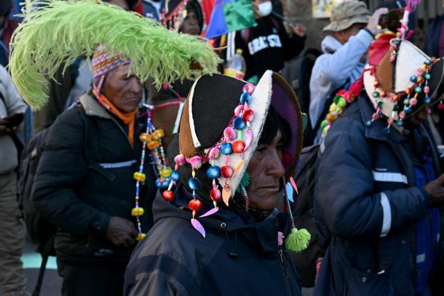 A demonstrator wearing a traditional hat marches during a protest against the government of Bolivia's President Rodrigo Paz in La Paz on June 10, 2026. For weeks, protesters demanding that US-backed conservative President Rodrigo Paz's fledgling government address a deep economic crisis, while others called for his resignation, have marched and set up roadblocks, bringing Bolivia to a near standstill, driving up food and fuel prices and causing shortages of basic goods. (Photo by AIZAR RALDES / AFP)