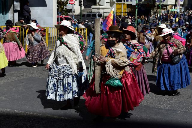 Women wearing traditional dress known as "cholitas" march to protest against the government of Bolivia's President Rodrigo Paz in La Paz on June 10, 2026. For weeks, protesters demanding that US-backed conservative President Rodrigo Paz's fledgling government address a deep economic crisis, while others called for his resignation, have marched and set up roadblocks, bringing Bolivia to a near standstill, driving up food and fuel prices and causing shortages of basic goods. (Photo by Jorge BERNAL / AFP)