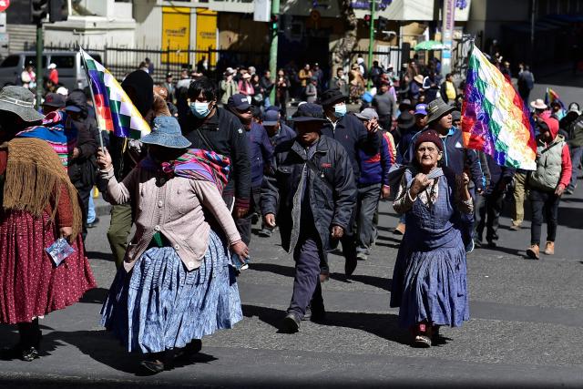 Demonstrators carrying Wiphala flags march during a protest against the government of Bolivia's President Rodrigo Paz in La Paz on June 10, 2026. For weeks, protesters demanding that US-backed conservative President Rodrigo Paz's fledgling government address a deep economic crisis, while others called for his resignation, have marched and set up roadblocks, bringing Bolivia to a near standstill, driving up food and fuel prices and causing shortages of basic goods. (Photo by Jorge BERNAL / AFP)
