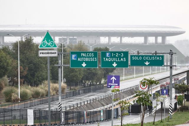 A photo shows an access road to Guadalajara Stadium, which will host matches of the 2026 World Cup football tournament, as seen under the rain in Zapopan, Jalisco state, Mexico, on June 10, 2026. (Photo by Ulises Ruiz / AFP)