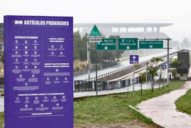 A photo shows an information panel notifying of banned items at the access to a security screening near the Guadalajara Stadium, which will host matches of the 2026 World Cup football tournament, as seen under the rain in Zapopan, Jalisco state, Mexico, on June 10, 2026. (Photo by Ulises Ruiz / AFP)