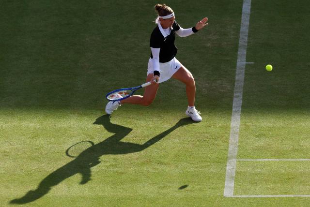 Czech Republic's Marie Bouzkova returns against Croatia's Donna Vekic during their round of 16 women's singles match at the HSBC WTA tennis Championships at Queen's Club in west London on June 10, 2026. (Photo by Adrian Dennis / AFP)