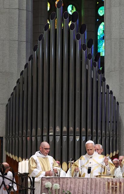 Pope Leo XIV (R) leads Holy Mass in the Basilica of the Sagrada Familia in Barcelona, on June 10, 2026. Pope Leo XIV is visiting Spain June 6-12 with stops in Madrid, Barcelona, and the Canary Islands, where he will meet with migrants and organisations dedicated to helping them. (Photo by Josep LAGO / AFP)