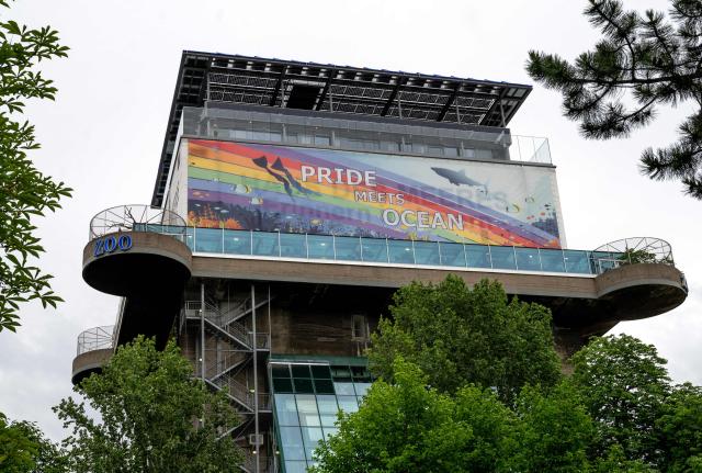 A large rainbow banner (reads Pride Meets Ocean ) placed at the Haus des Meeres (House of the Sea) zoo located at an old anti aircraft flag tower in Vienna, Austria, on June 10, 2026. As part of Pride Month, the House of the Sea invites visitors on an extraordinary journey of discovery on June 12th. Three exclusive guided tours with drag queen Tamara Mascara will take place, demonstrating that diversity in the animal kingdom is as natural as the tides. (Photo by Joe Klamar / AFP)