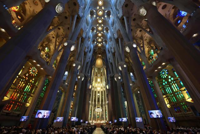 People attend Holy Mass led by Pope Leo XIV in the Basilica of the Sagrada Familia in Barcelona, on June 10, 2026. Pope Leo XIV is visiting Spain June 6-12 with stops in Madrid, Barcelona, and the Canary Islands, where he will meet with migrants and organisations dedicated to helping them. (Photo by Josep LAGO / AFP)