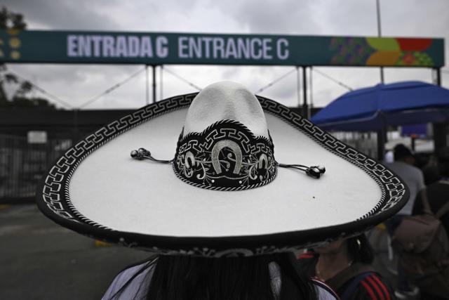A supporter wearing a Mexican hat poses outside Estadio Guadalajara on the eve of the 026 World Cup football tournament opening match in Guadalajara on June 10, 2026. (Photo by Alfredo ESTRELLA / AFP)