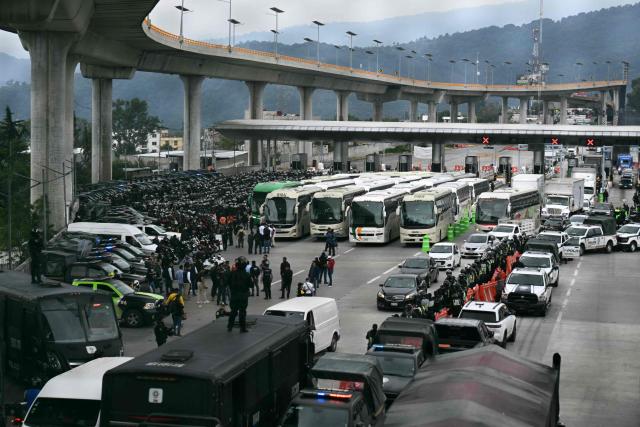 View during a police operation that keeps retained buses transporting students from Ayotzinapa who try to enter the city and join the protests of teachers and relatives of missing people ahead of the start of the 2026 FIFA World Cup, on the outskirts of Mexico City, on June 10, 2026. (Photo by YURI CORTEZ / AFP)
