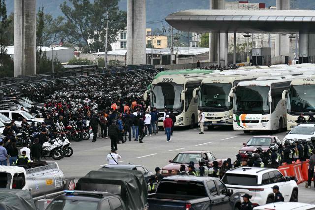 View during a police operation that keeps retained buses transporting students from Ayotzinapa who try to enter the city and join the protests of teachers and relatives of missing people ahead of the start of the 2026 FIFA World Cup, on the outskirts of Mexico City, on June 10, 2026. (Photo by YURI CORTEZ / AFP)
