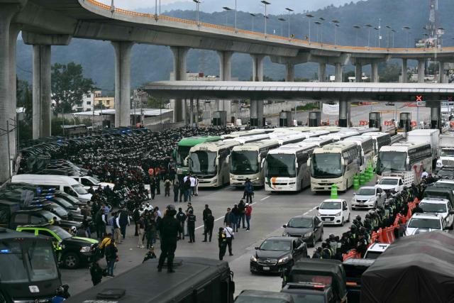 View during a police operation that keeps retained buses transporting students from Ayotzinapa who try to enter the city and join the protests of teachers and relatives of missing people ahead of the start of the 2026 FIFA World Cup, on the outskirts of Mexico City, on June 10, 2026. (Photo by YURI CORTEZ / AFP)