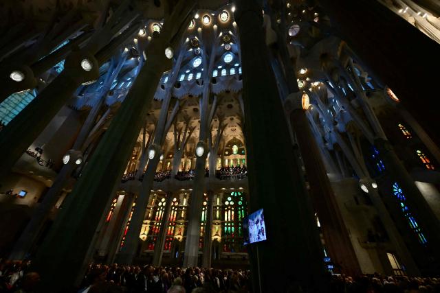 Faithfuls attend a Holy Mass led Pope Leo XIV in the Basilica of the Sagrada Familia and inauguration of the Jesus Christ tower in Barcelona, on June 10, 2026. Pope Leo XIV is visiting Spain June 6-12 with stops in Madrid, Barcelona, and the Canary Islands, where he will meet with migrants and organisations dedicated to helping them. (Photo by Stefano RELLANDINI / AFP)