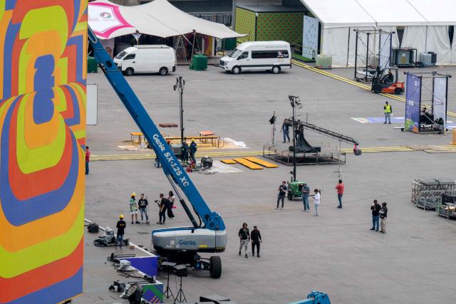 Workers set up the FIFA Fan Fest installations at Zocalo Square, one day before the opening of the 2026 FIFA World Cup football tournament in Mexico City on June 10, 2026. (Photo by Gerardo Luna / AFP)