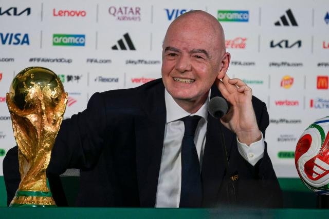 FIFA President Gianni Infantino gestures during a press conference with the World Cup trophy on the eve of the opening match of the 2026 World Cup football tournament at Mexico city stadium in Mexico City on June 10, 2026. (Photo by Alfredo ESTRELLA / AFP)