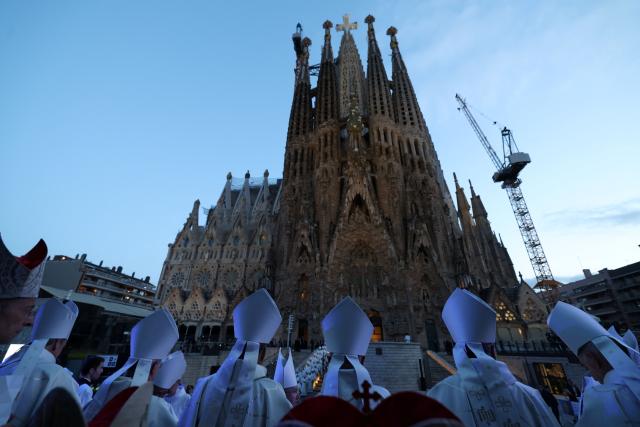 Bishops attend the inauguration of the Jesus Christ tower by Pope Leo XIV, outside of the Basilica of the Sagrada Familia, in Barcelona, on June 10, 2026. Pope Leo XIV is visiting Spain June 6-12 with stops in Madrid, Barcelona, and the Canary Islands, where he will meet with migrants and organisations dedicated to helping them. (Photo by Lluis GENE / AFP)